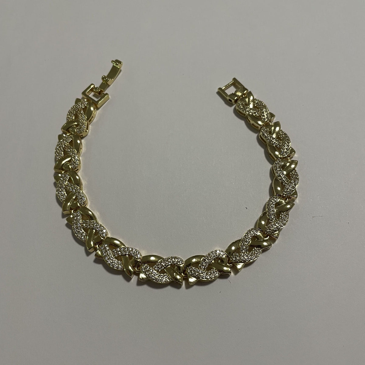 Bracelet maille cubaine doré orné de strass