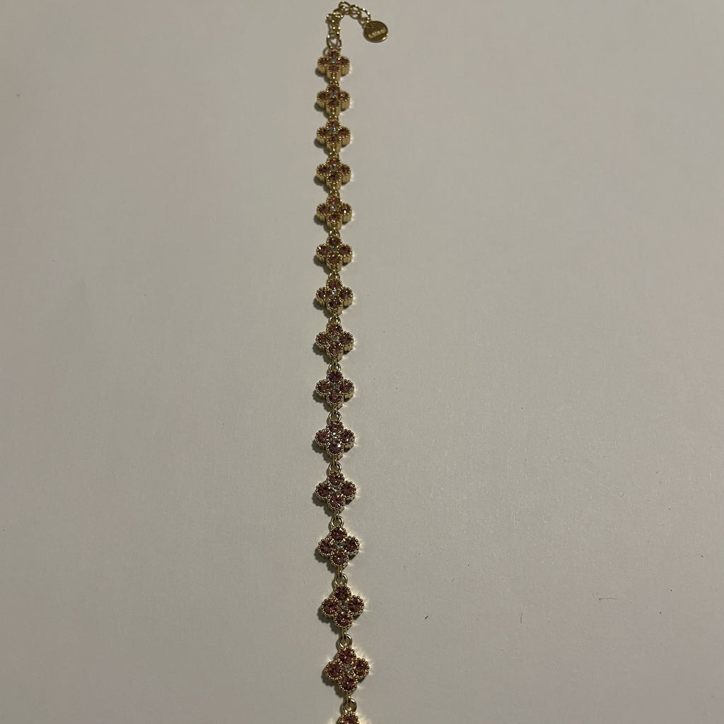 Bracelet doré à trèfles quatre feuilles ornés de strass roses