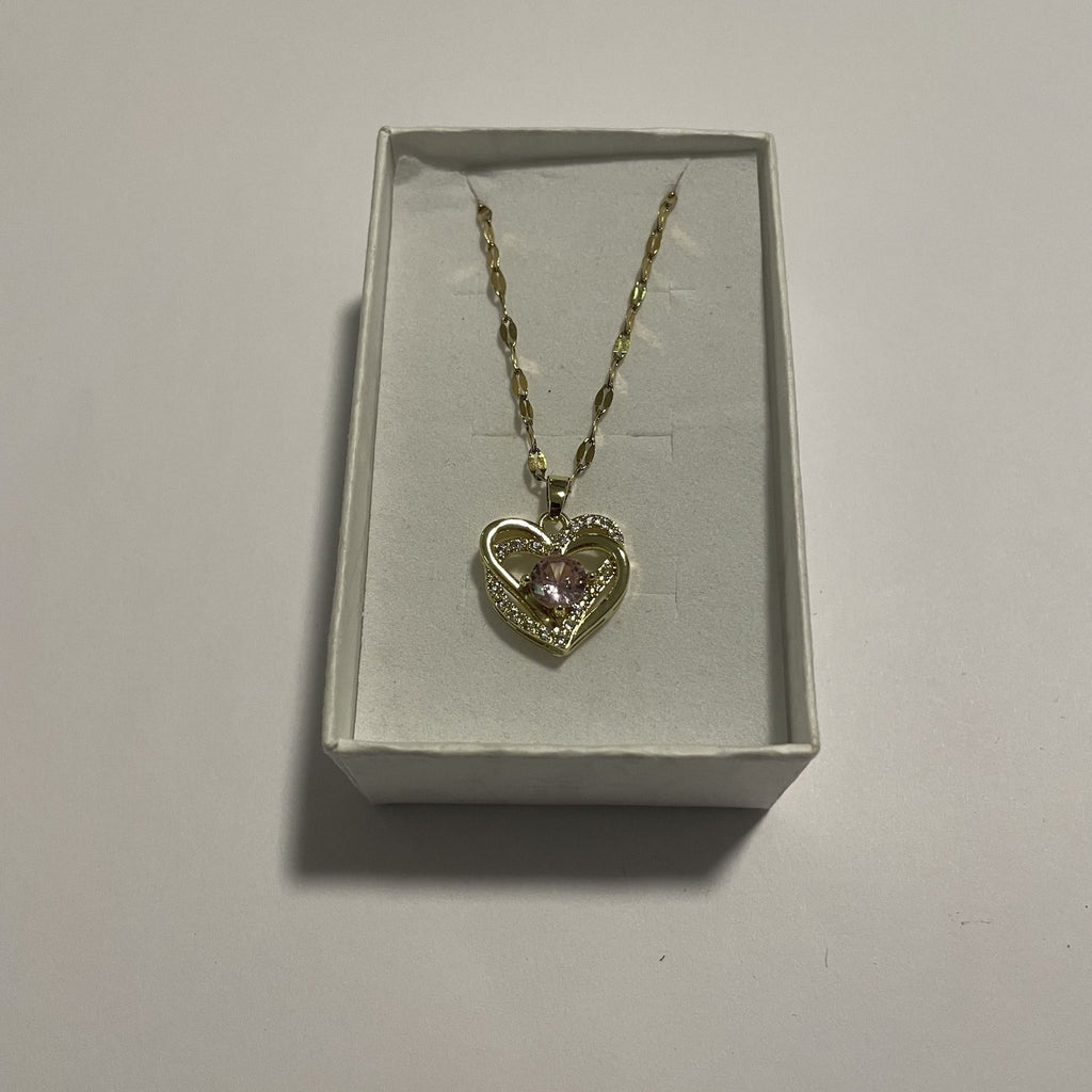 Collier cœur doré avec élément central rose et strass