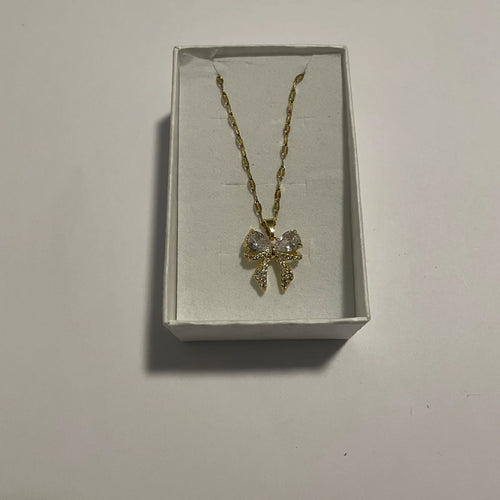 Collier nœud doré orné de strass et éléments transparents